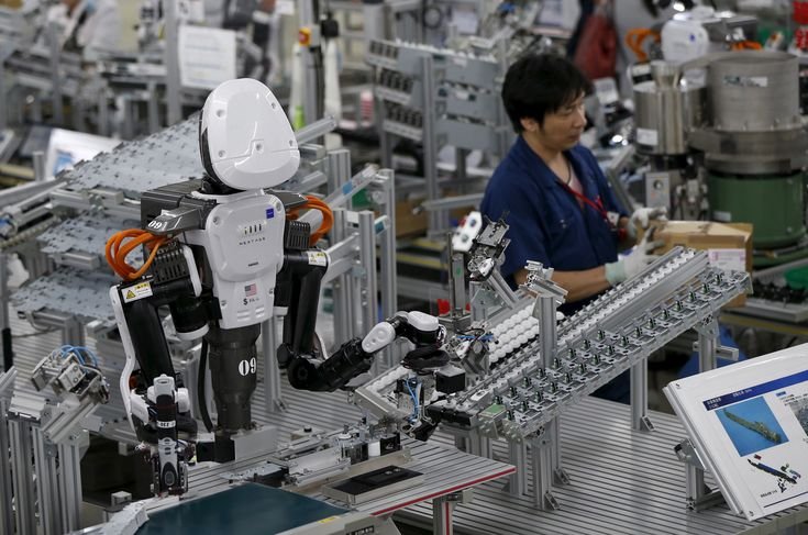 robot e lavoratori fianco a fianco